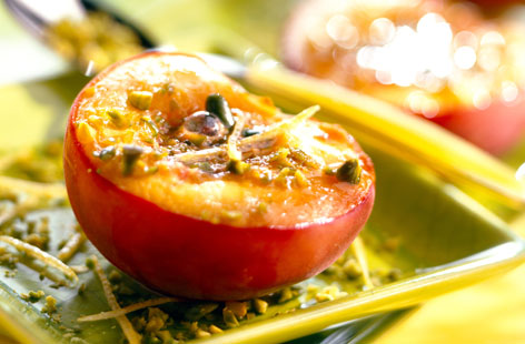 Grilled peach halves with pistachios