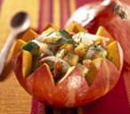 Pumpkin salad served in half a pumpkin