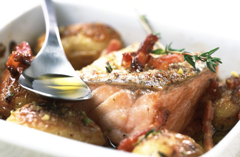 Salmon steak with potatoes and bacon
