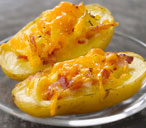 Baked potatoes stuffed with cheddar and bacon