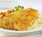 Fish in red pepper sauce with pasta and vegetables