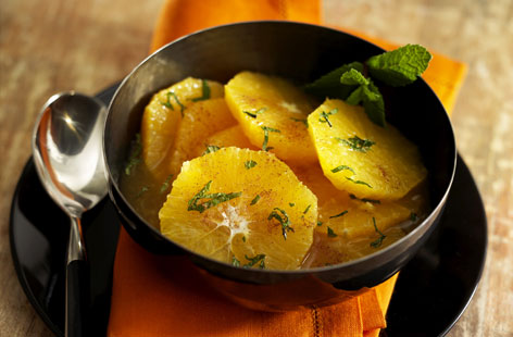 Orange fruit salad with cinnamon and mint