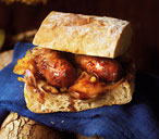 Cider-glazed hot dogs with sticky shallots