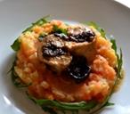 Prunes stuffed chicken thighs in creamy sauce on root vegetable mash.