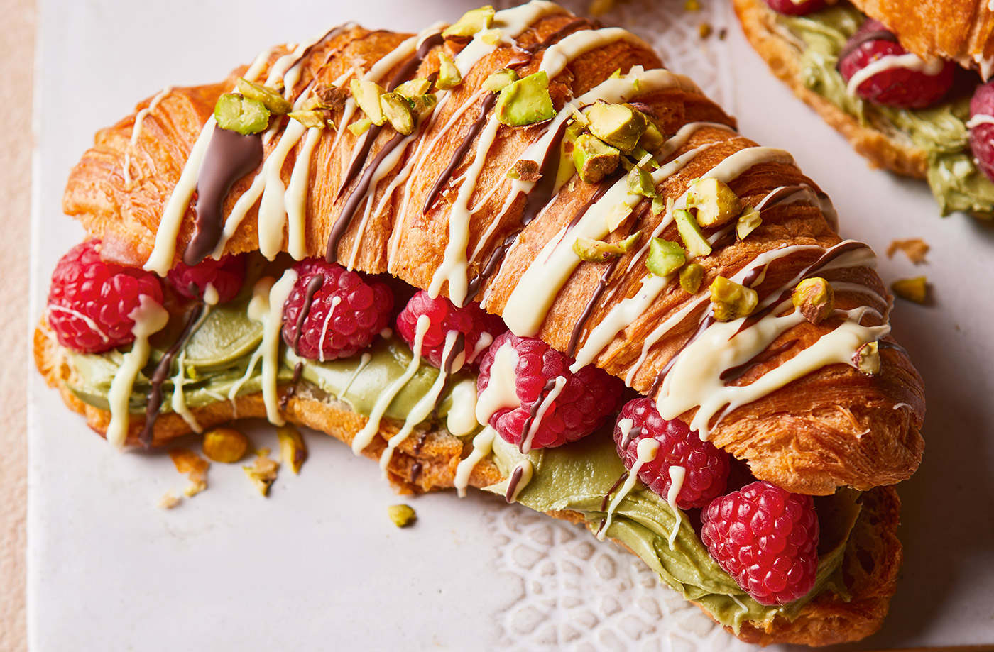 Drizzled croissants with pistachios and raspberries recipe