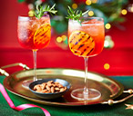 Charred Orange And Cranberry Aperol Spritz Recipe | Christmas Cocktail Recipes | Tesco Real Food