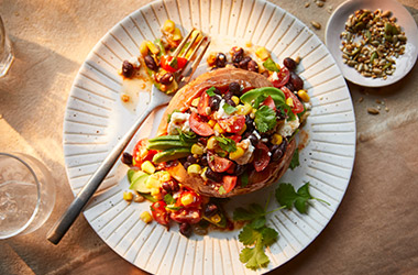 Baked sweet potatoes with bean salsa