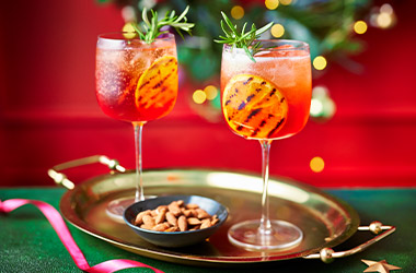 Charred orange and cranberry Aperol sprtiz