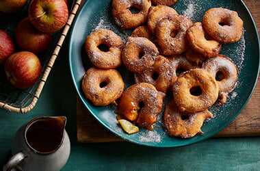 Spiced apple doughnuts with caramel sauce