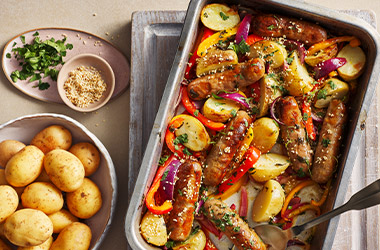 Sausage and Jersey Royal traybake