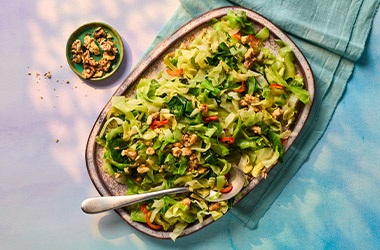 Shredded cabbage with shallots and walnuts