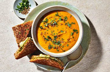 Spiced carrot and lentil soup with cheesy pesto toasties