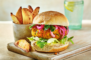 Spiced red lentil burgers with potato wedges