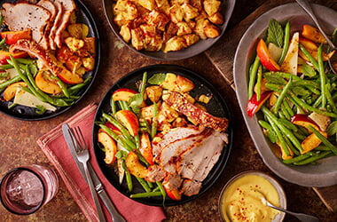 Paprika and garlic rubbed roast pork with roast potatoes, nectarine salad and saffron aioli