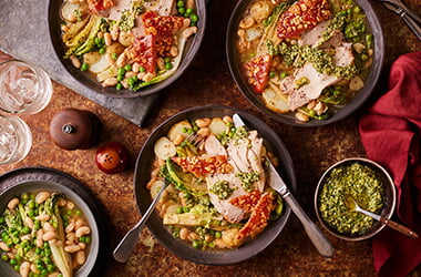 Roast pork with braised lettuce, cannellini beans, new potatoes and almond pesto