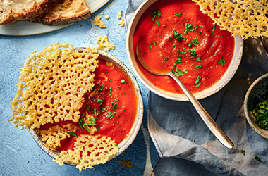 Tomato soup with cheesy topper