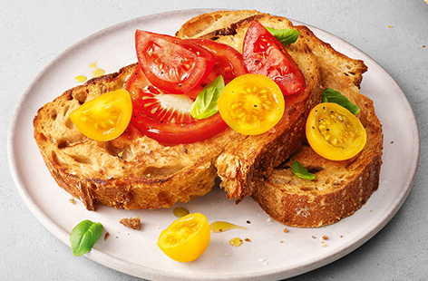 Crunchy sourdough, sweet baby tomatoes and good quality extra-virgin olive oil make this simple Italian-inspired dish light yet satisfying. Enjoy for brunch, lunch or as a snack, alternatively serve as an appetizer at a get-together meal.  Finish with torn basil leaves and cracked black pepper – bellissimo!