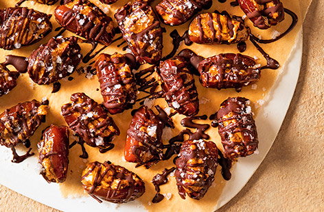Dates are rich in protective antioxidants and increase your blood sugar less than most sweeteners, making them a terrific snack. Here we've stuffed dates with crunchy almond butter and drizzled them with dark chocolate, for an indulgent-tasting yet nutritious sweet treat.