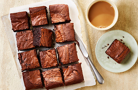 Master the perfect brownie with our tried-and-tested recipe. Nice and gooey in the middle but with a crisp edge, everyone will be asking for this chocolate brownie recipe! Lovely with a cuppa or served as an indulgent dessert with a scoop of ice cream.