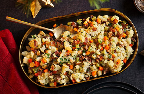 Try making your own stuffing this Christmas. This gluten-free version is made from finely chopped cauliflower, herbs, dried fruit and nuts. We've added bacon to ours, but you can leave it out to make this recipe vegan!