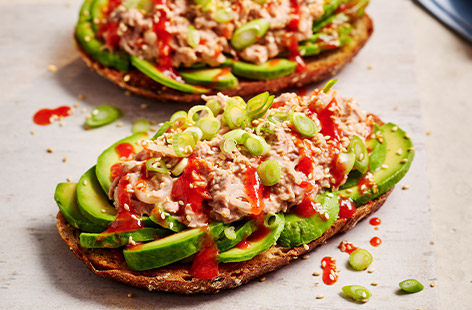 We've given the classic tuna sarnie a spicy twist with  a limey sriracha mayo and served it as an open sandwich with avocado for an easy, modern twist. That's your next lunch sorted!