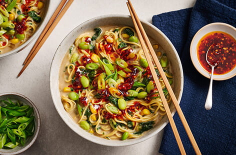 Try something new with these tasty peanut butter recipes for bakes, satay stir-fries and more.