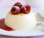 Vanilla panna cotta with raspberries and fruit sauce | Tesco Real Food