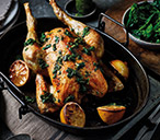 Roast chicken with basil and lemon salsa and garlic potatoes | Tesco Real Food