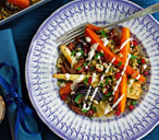 Root and nut traybake with pomegranate and yogurt dressing | Tesco Real Food