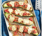 Stuffed courgettes with rocket salad | Tesco Real Food