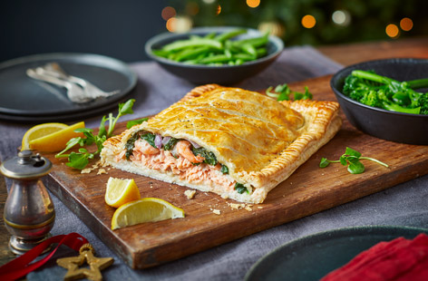 This special fish supper takes salmon en croûte to the next level with an extra layer of king prawns and spinach in the filling